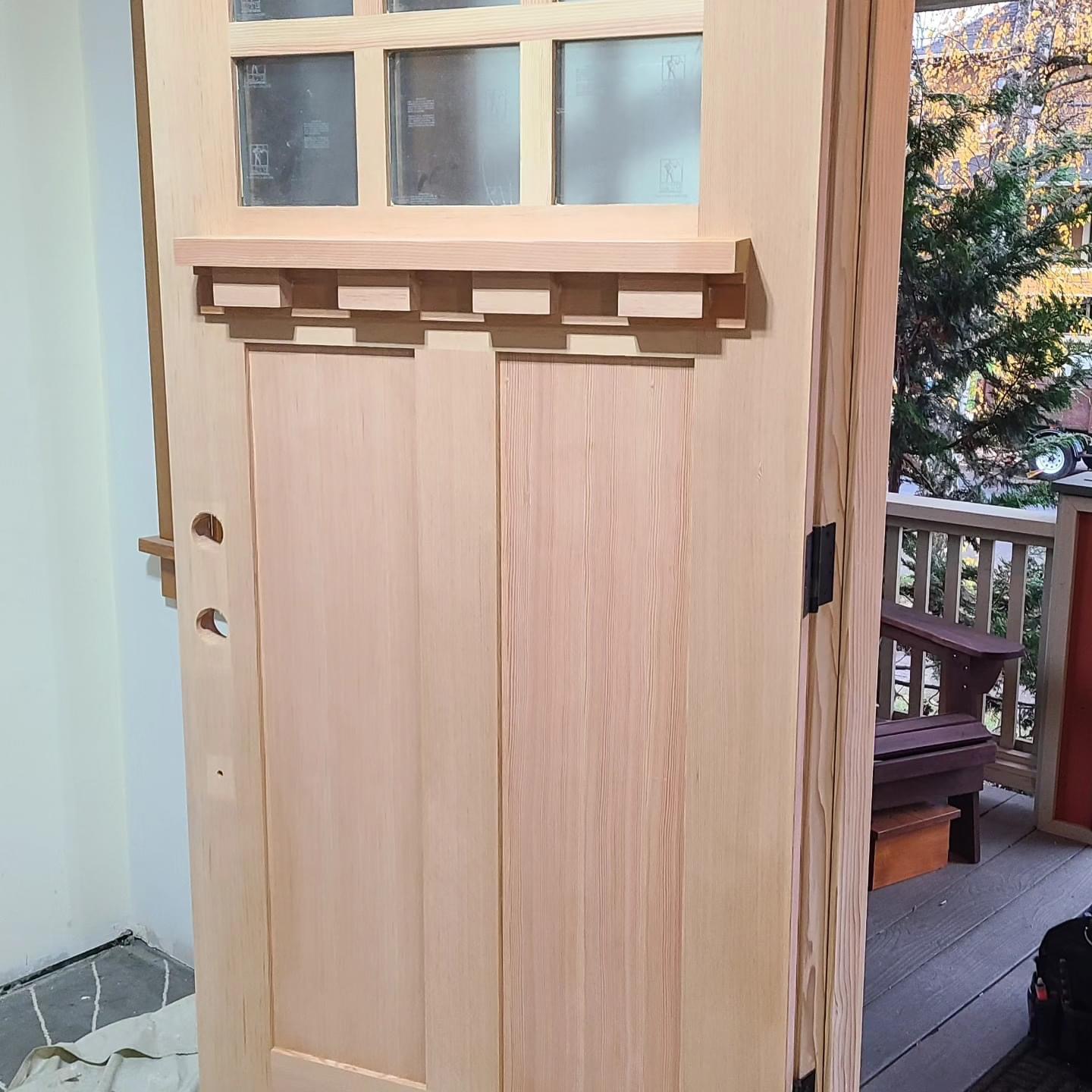 Craftsman door with dentil shelf prepared for finish