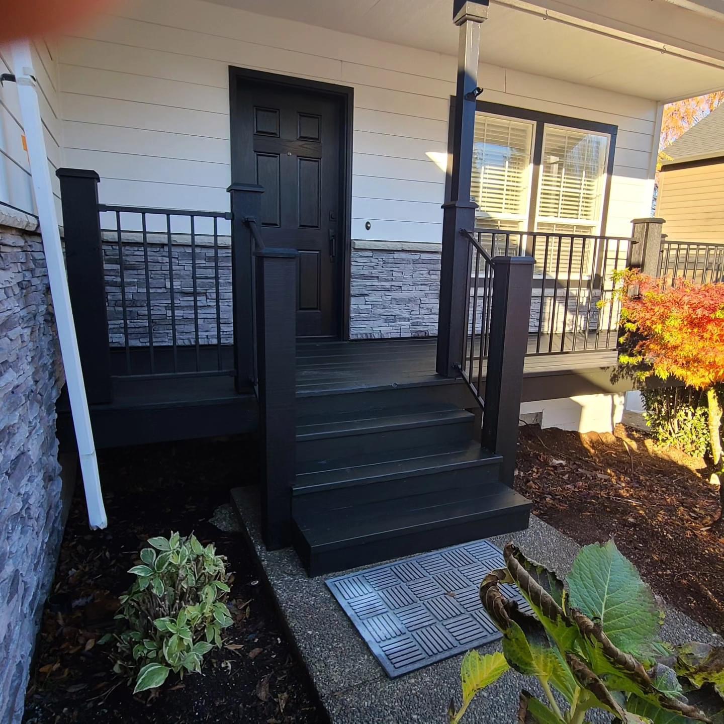 New porch steps and black railing built in Keizer OR
