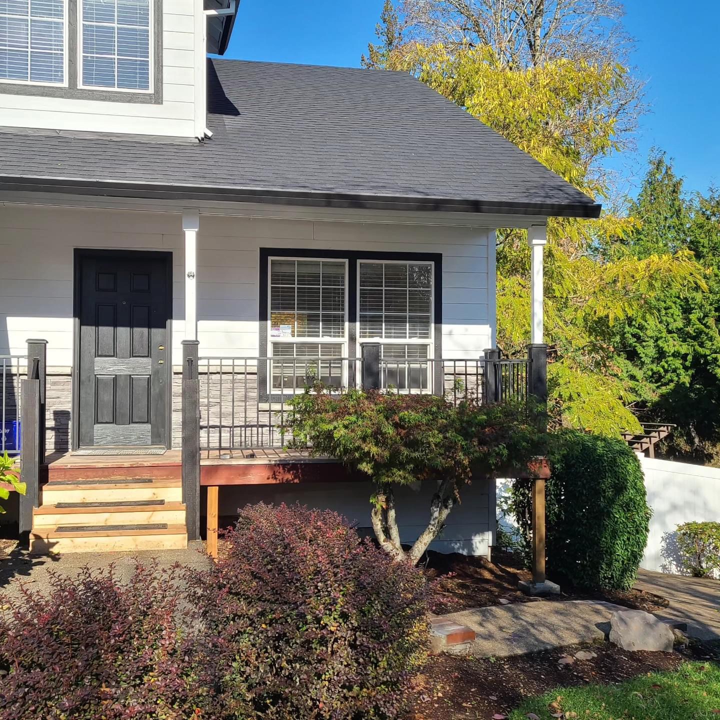 Exterior repaint with new porch railing on a Keizer Oregon farmhouse