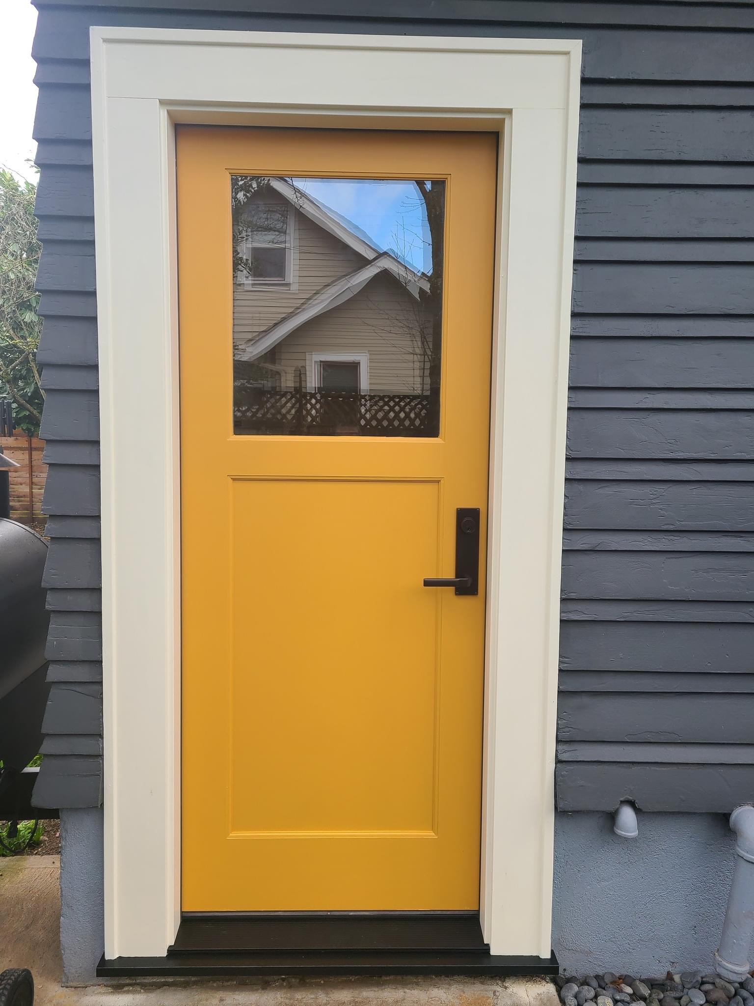 Marigold painted entry door with cream trim, Salem Oregon